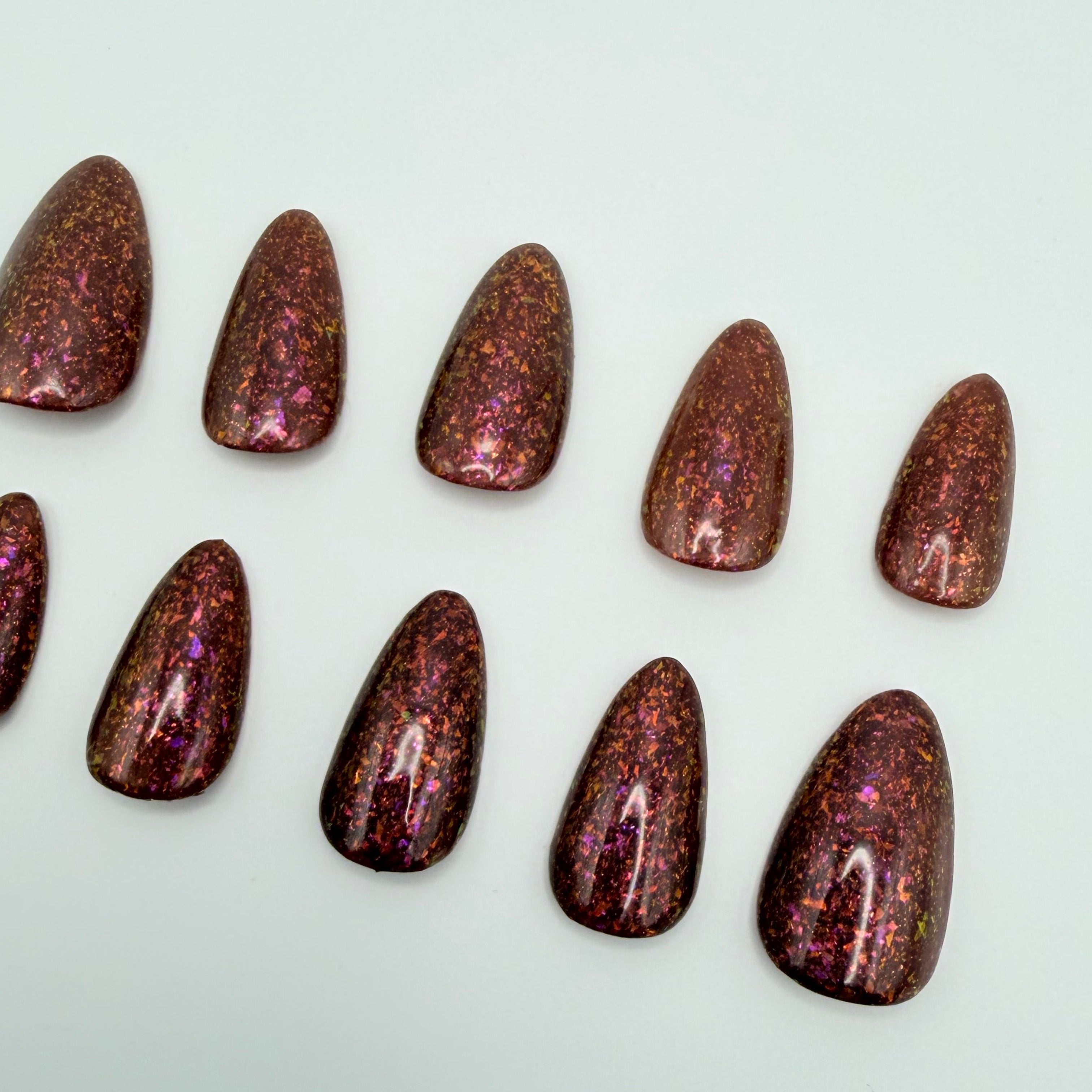 Solo Mission press-on nails featuring Holo Taco's rich earthy terracotta specialty polish, painted by smll cnvs